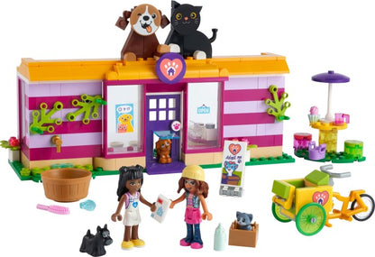 LEGO Friends: Friends Pet Adoption Café 41699 Building Kit; Birthday Gift Idea Comes with Olivia and Priyanka Mini-Dolls, 2 Dogs and 1 Cat Toy; For Kids Aged 6+ (292 Pieces) (41699) - New Sealed - play features
